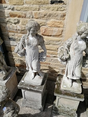 Lot 1119 - A pair of weathered composition garden statues...