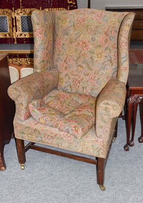 Lot 1161 - A George III wing back armchair (in need of...