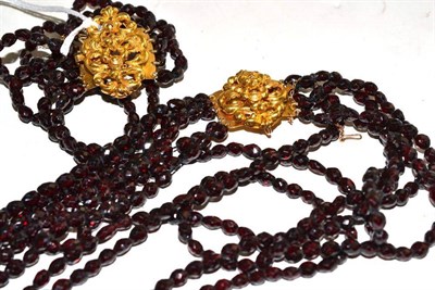 Lot 170 - A Victorian faceted bead necklace, possibly garnet, length (of shortest strand) 38cm and a matching