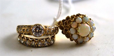 Lot 173 - A 9ct gold opal cluster ring and two 9ct gold cubic zirconia rings (3)