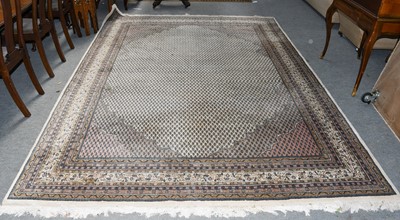 Lot 1005 - Indian carpet, the ivory field of boteh...