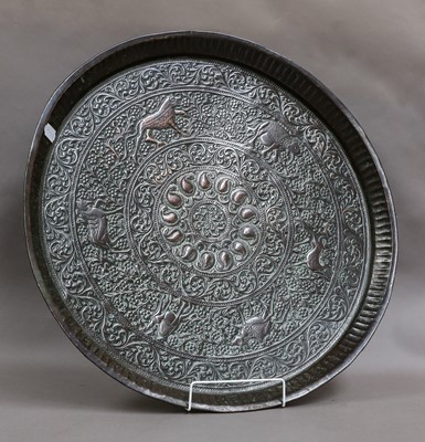 Lot 213 - A Persian tinned copper charger, 58cm diameter