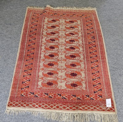 Lot 1082 - A Baluch prayer rug, the cream field of...