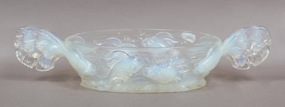 Lot 134 - A large opalescent twin-handled glass bowl...