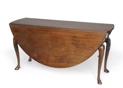 Lot 1197 - A George III Mahogany Six-Seater Double Gateleg Table, possibly Irish, of rounded form, raised...