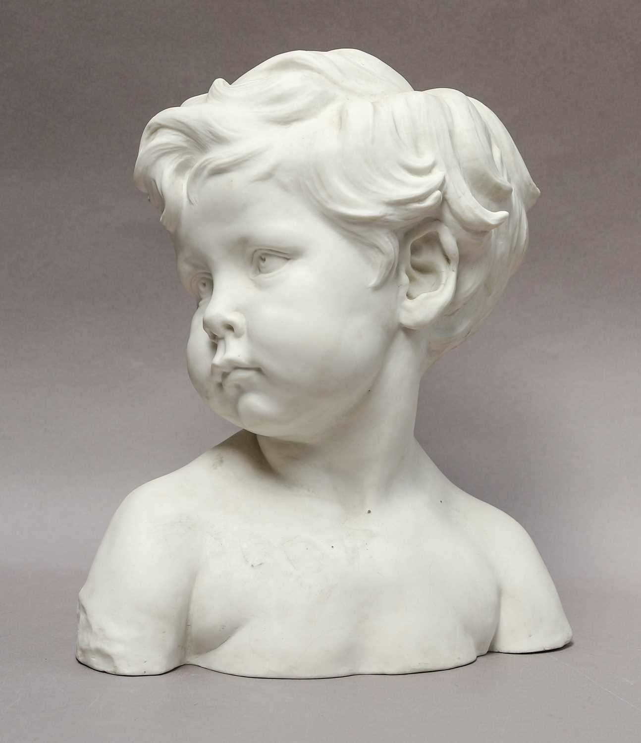 Lot 155 - A Parian bust of a young boy, stamped Sevres