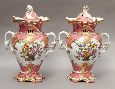 Lot 165 - A pair of Rockingham style continental pink...