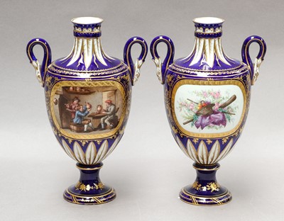 Lot 69 - A pair of Sevres twin-handled vases decorated...