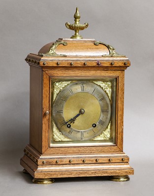 Lot 40 - A German oak striking table clock, movemet...