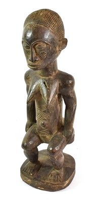 Lot 2387 - A Baule Maternity Figure, Ivory Coast, seated...