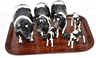 Lot 222 - A Beswick Friesian cow - Claybury Clearwater, another example, a bull and three calves (a.f.)