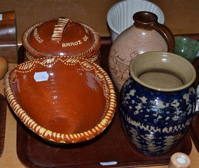 Lot 224 - A tray of ceramics including slipware, stoneware flask, jelly moulds and two carved wooden abstract