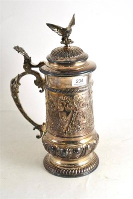 Lot 234 - A large silver plated embossed tankard