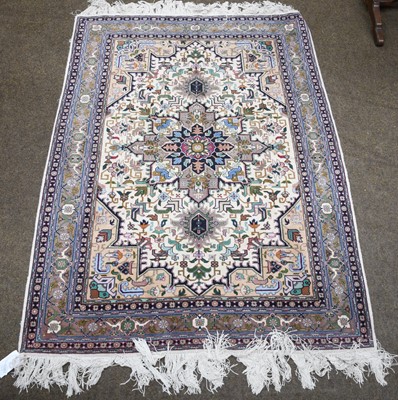 Lot 1091 - A finely woven oriental rug, probably Tabriz,...