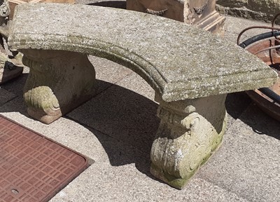 Lot 1123 - A reconstituted stone garden bench with curved...