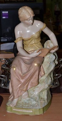 Lot 241 - A large Royal Dux figure of a seated maiden