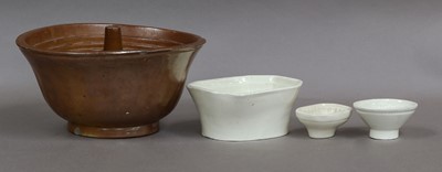 Lot 195 - A group of pottery and copper jelly moulds,...