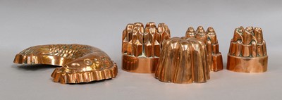 Lot 195 - A group of pottery and copper jelly moulds,...