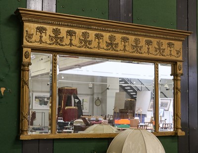 Lot 1131 - A Regency gilt framed sectional mirror,...