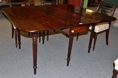 Lot 1202 - A William IV Six-Seater Gateleg Table, 2nd quarter 19th century, with two rounded drop leaves,...