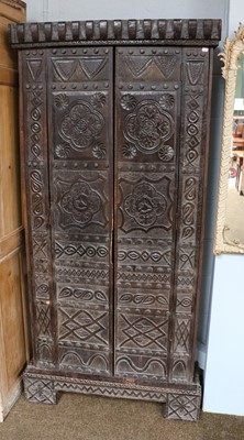 Lot 1191 - An ornately carved Provincial oak two-door...