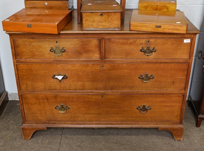 Lot 1225 - An early 20th century oak three-height chest...