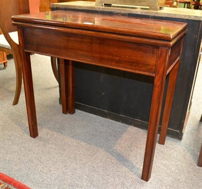 Lot 1203 - A George III Mahogany Foldover Tea Table, 3rd quarter 18th century, of rectangular form with square