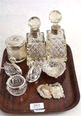 Lot 263 - A pair of silver mounted cut glass scent bottles and stoppers, a silver bottle label Madeira, a...