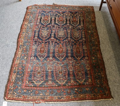 Lot 1080 - A Hamadan rug, the indigo field of stylised...