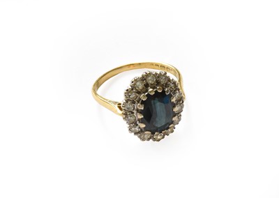 Lot 297 - An 18 carat gold sapphire and diamond cluster...