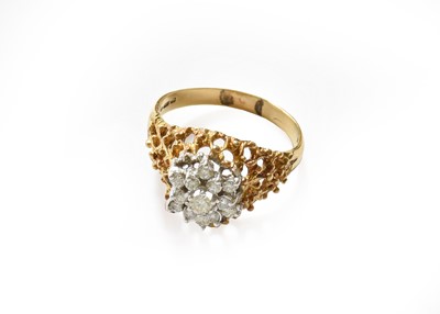 Lot 288 - An 18 carat gold diamond cluster ring, finger...