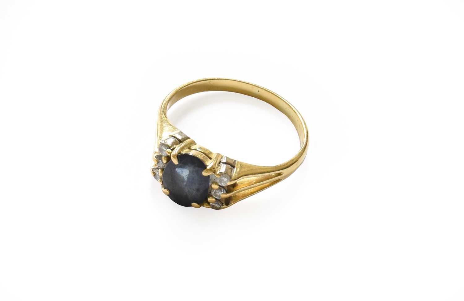 Lot 76 - A sapphire and diamond ring, finger size O