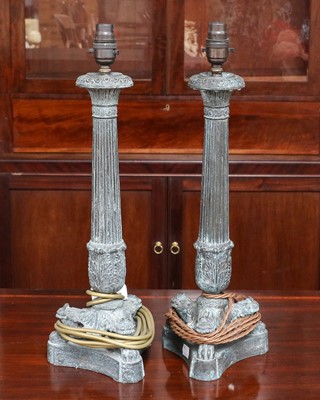 Lot 1229 - A pair of patinated Regency style table lamps...