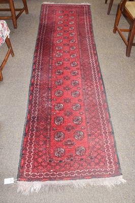 Lot 1092 - An Afghan Turkmen runner, the scarlet field...