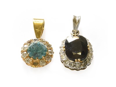 Lot 281 - A blue zircon and diamond cluster pendant,...