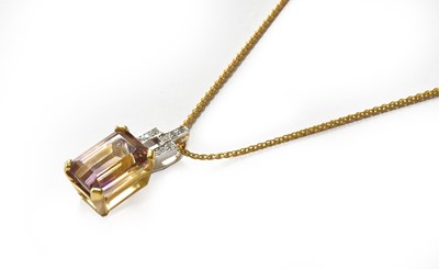 Lot 300 - An 18 carat gold ametrine and diamond pendant...