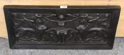 Lot 1109 - A cast iron fire back decorated in relief with...