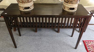 Lot 1125 - A stained and slatted console table, 137cm by...