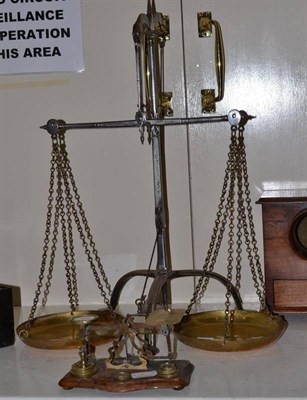 Lot 278 - A pair of brass and steel pan scales and a set of postal scales and weights