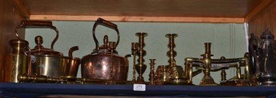 Lot 279 - A shelf of brass and copper including kettles, candlesticks, fire irons, etc