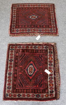 Lot 1097 - A pair of Baluch bagfaces, each face centred...