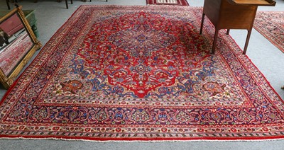 Lot 1099 - A Tabriz carpet, the scarlet field of...