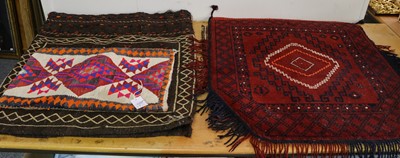 Lot 1100 - A Turkmen saddle cover, the blood red field...