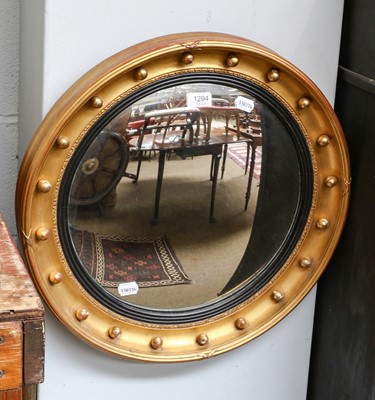 Lot 1294 - A Regency gilt framed convex mirror with...