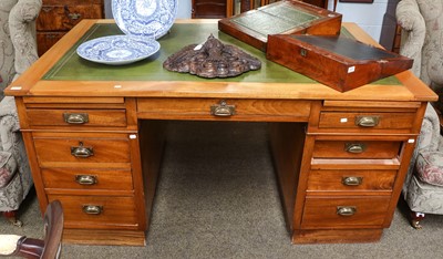 Lot 1278 - An early 20th century leather inset desk,...