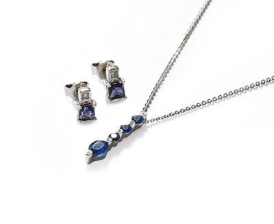 Lot 319 - A sapphire and diamond pendant on chain, both...