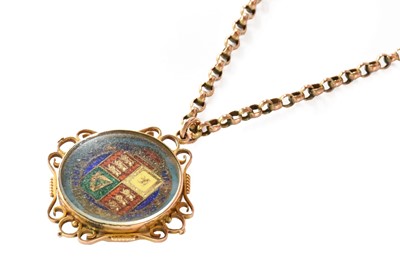 Lot 105 - An enamel and gilt shilling coin pendant on...