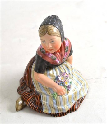 Lot 298 - A Royal Copenhagen figure of `Faro' - a girl in National costume seated and holding a posy of...