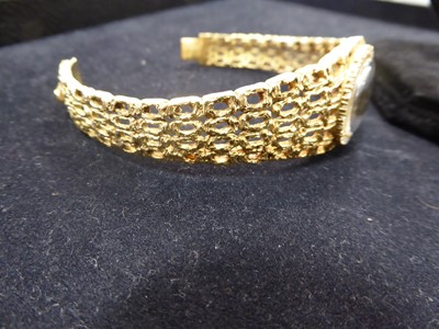 Lot 2172 - A Lady's 18 Carat Gold Diamond Set Wristwatch...