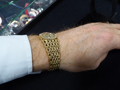 Lot 2172 - A Lady's 18 Carat Gold Diamond Set Wristwatch...